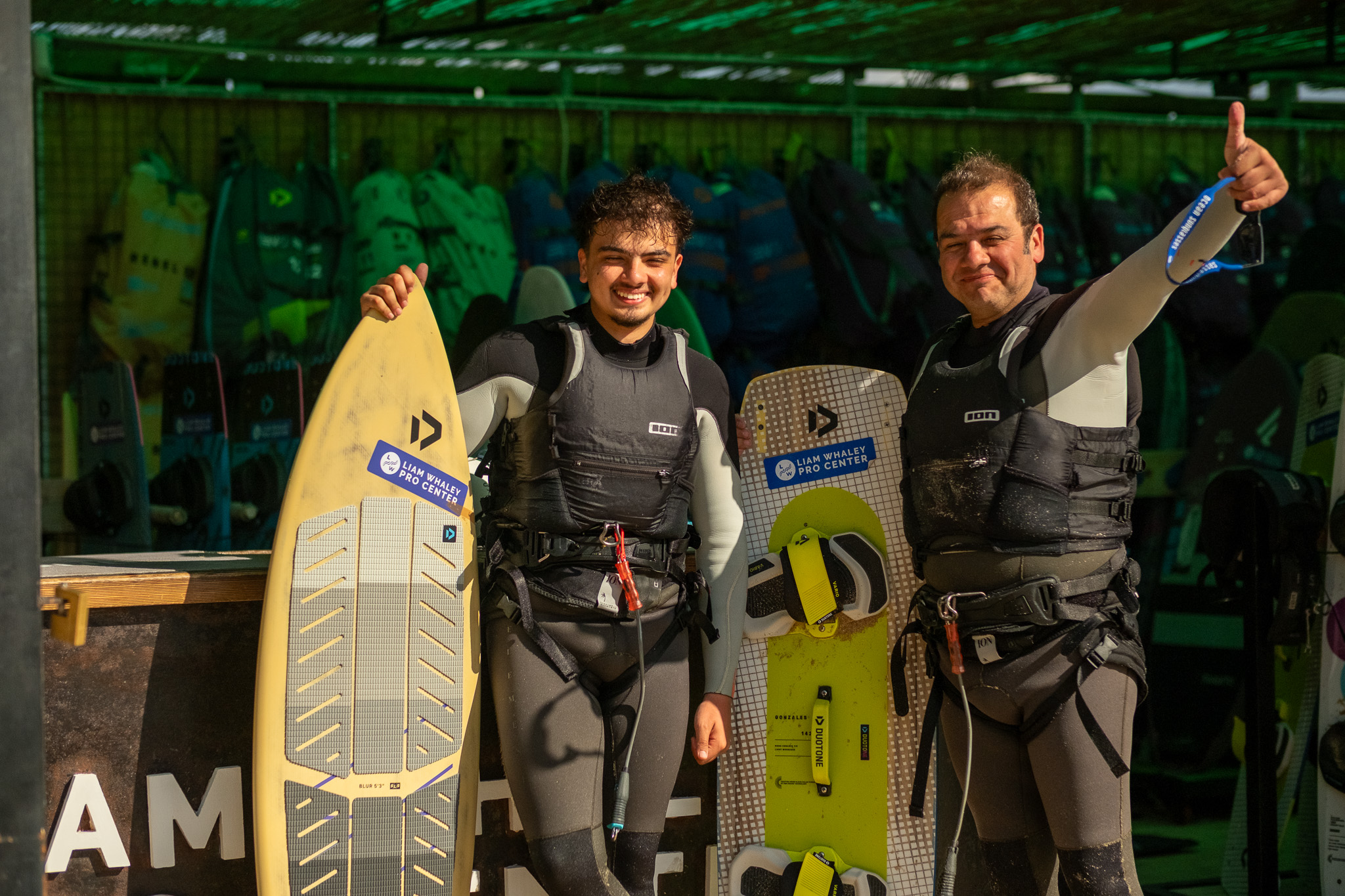 Independent kitesurf riders with Duotone boards at Liam Whaley Pro Center in Tarifa before a rental session
