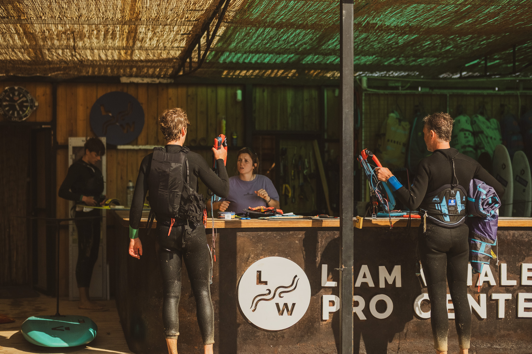 Riders checking in and selecting kitesurf equipment at Liam Whaley Pro Center on Valdevaqueros Beach