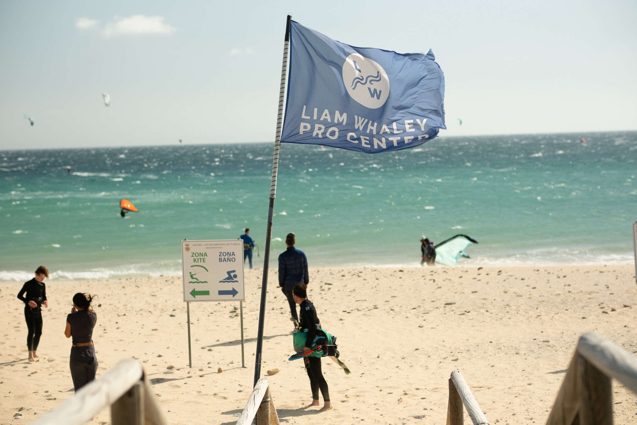 Liam Whaley Pro Center flag overlooking the kitesurfing teaching area at Valdevaqueros Beach in Tarifa