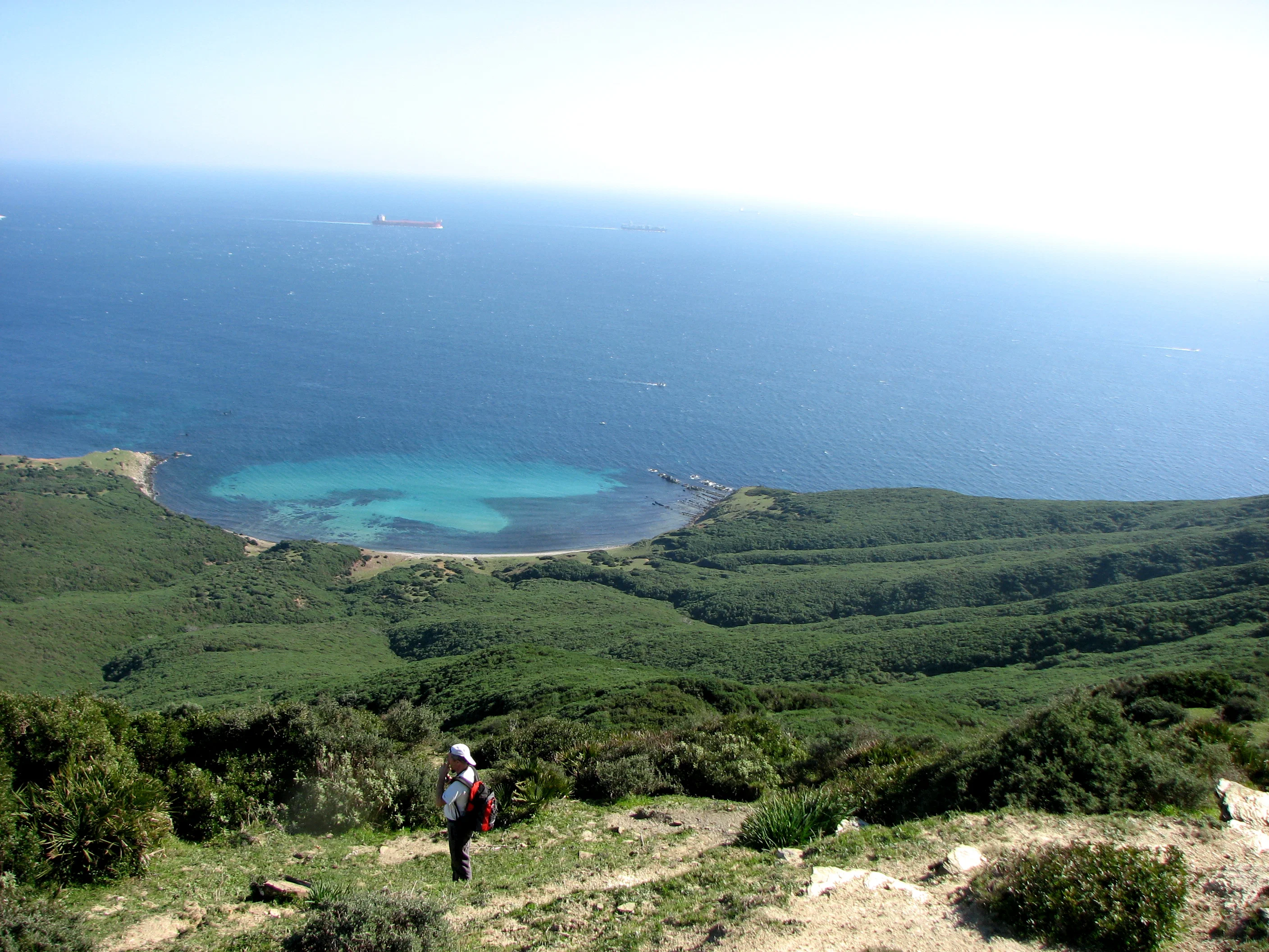 Panoramic view of Parque Natural del Estrecho near Tarifa, with green hills, coastline, and turquoise water below