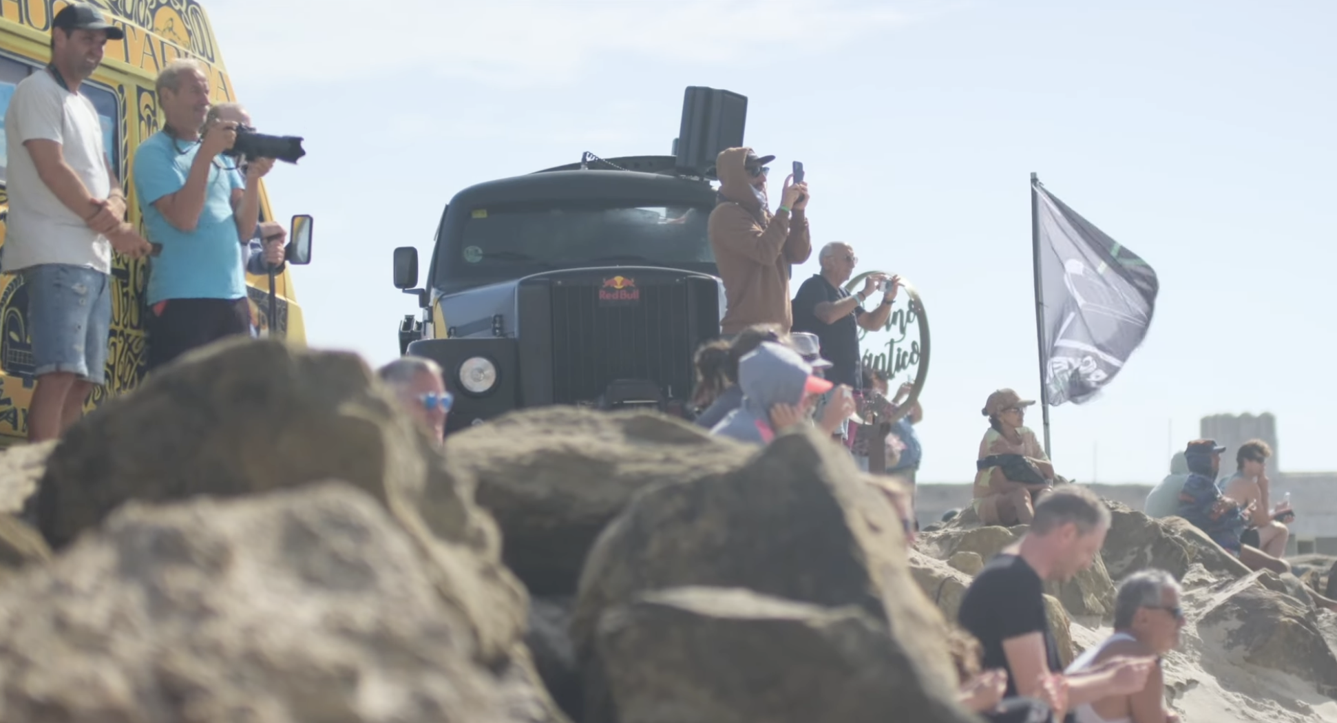 Spectators watching Big Air kitesurfing event from rocks during Red Bull King of the Air qualifier in Tarifa