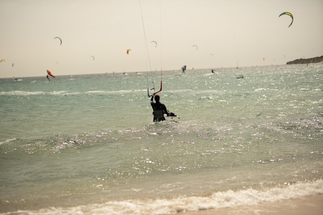 Student practicing body dragging during a kitesurf lesson at Valdevaqueros Beach in Tarifa