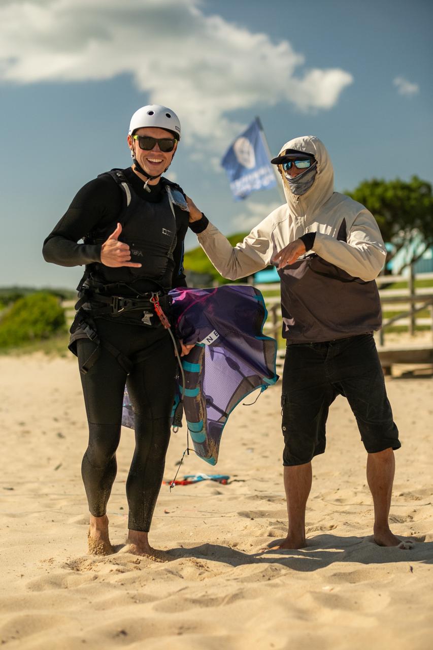 Beginner kitesurfing lesson in Tarifa with student and instructor at Liam Whaley Pro Center on Valdevaqueros Beach.