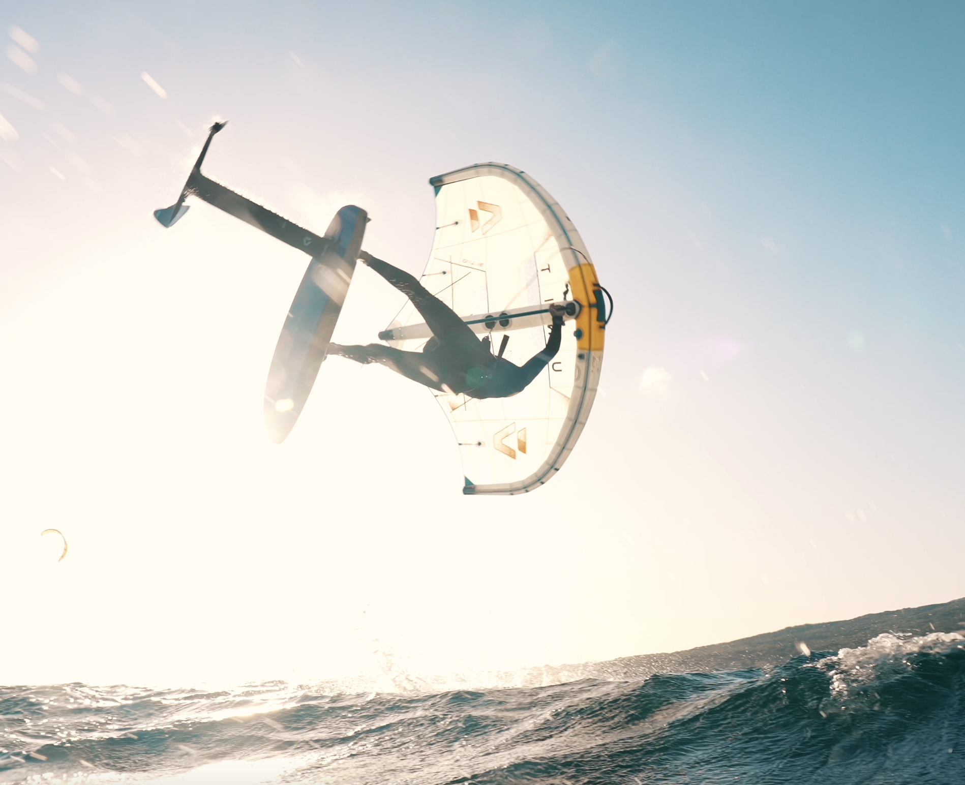 A wing foiler doing a backroll with duotone gear from Liam Pro Center