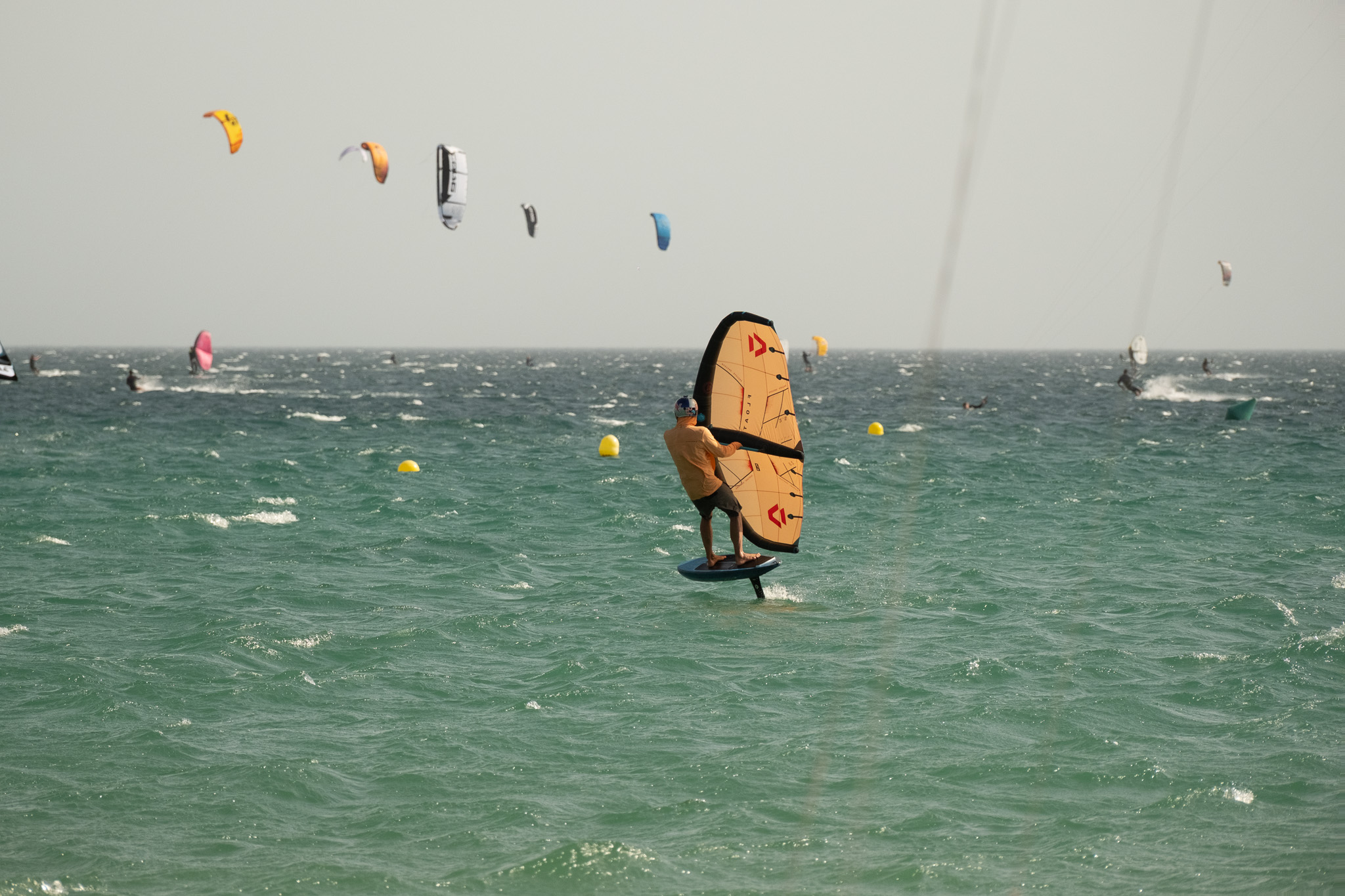 Wingfoiler riding in windy conditions at Valdevaqueros Beach in Tarifa